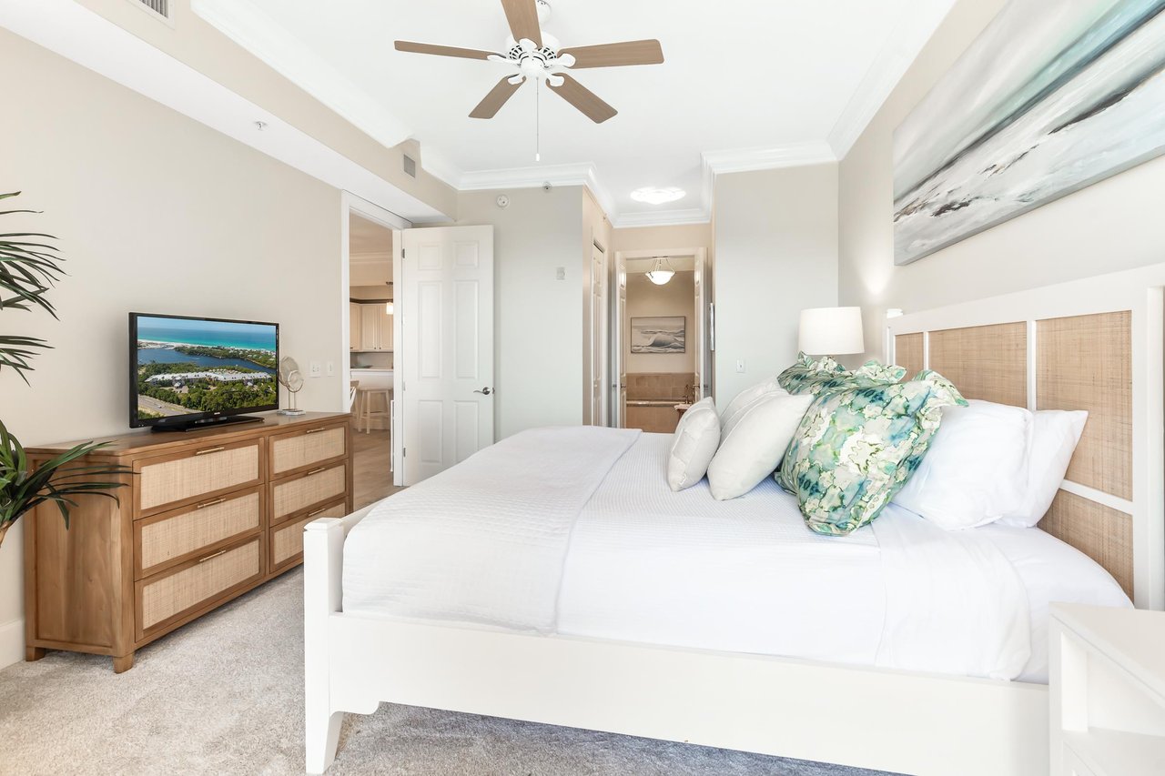 Unwind in your serene bedroom with plush linens, soothing coastal accents, and a bright, airy ambiance that invites restful nights and refreshing mornings.