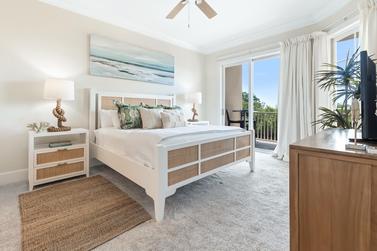 Your serene coastal retreat awaits with a plush bed, soothing oceaninspired decor, and private balcony access where you can unwind with natural light and refreshing breezes.