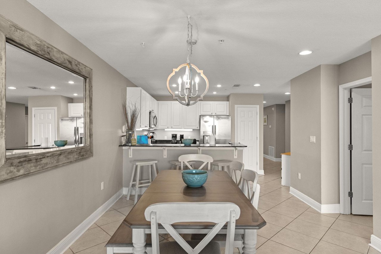 Your dining area flows effortlessly into a bright kitchen, perfect for gathering over meals and sharing vacation moments together.