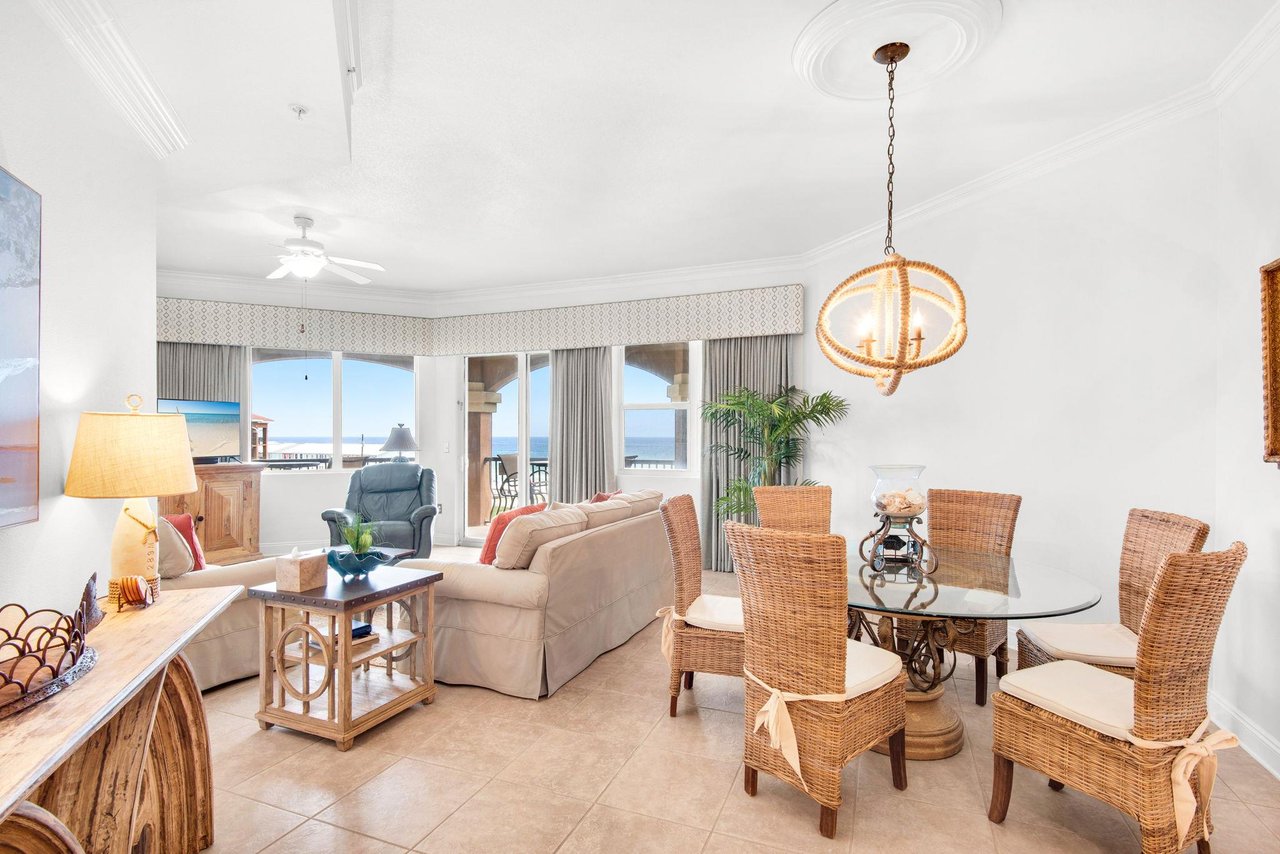 Natural light fills the bright space, where wicker chairs and beachinspired décor set a tranquil coastal tone.