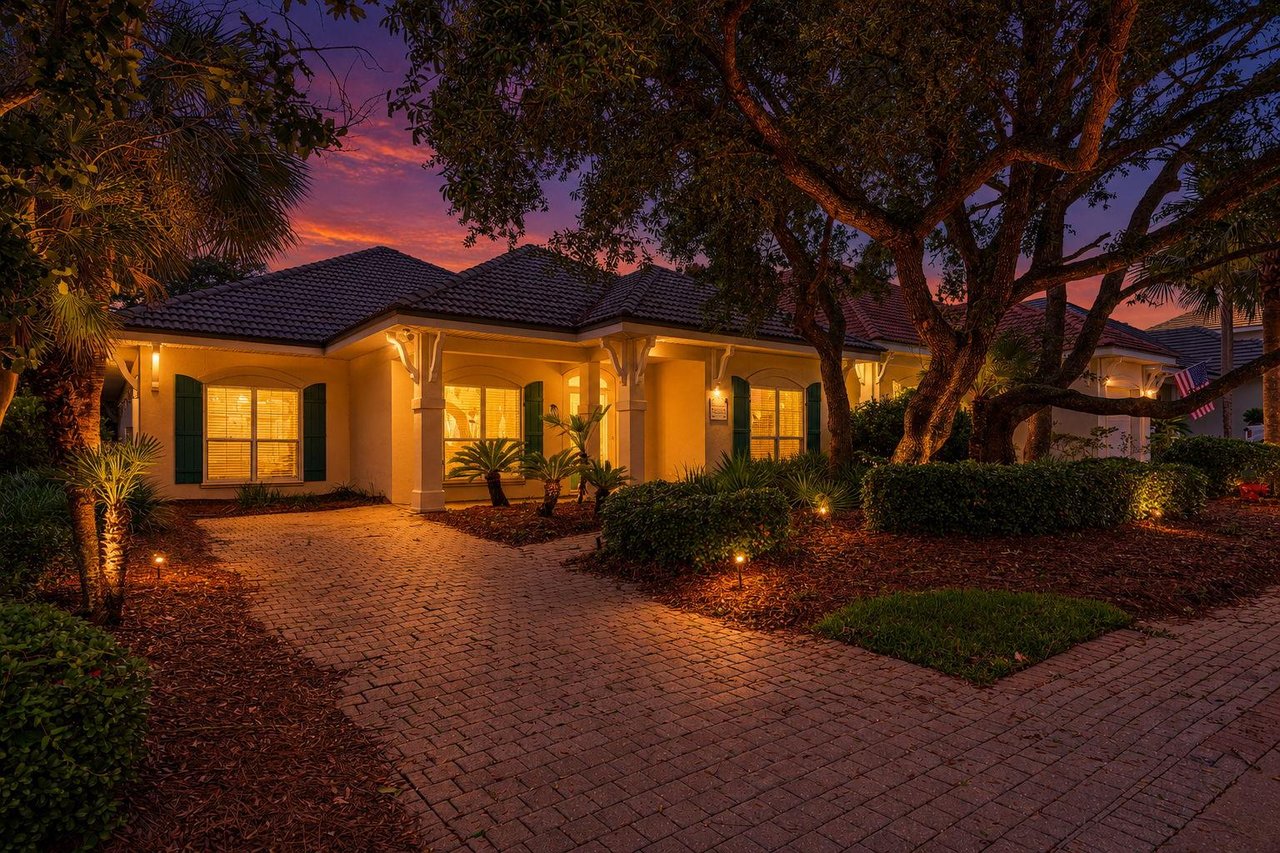 A beautifully lit property illuminated entrance and pathways create a welcoming arrival.