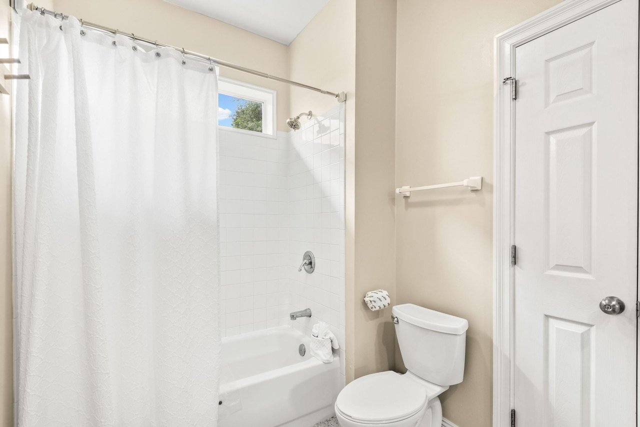 Refresh in your private bathroom with a full tubshower combo, and soft natural light streaming through the window.