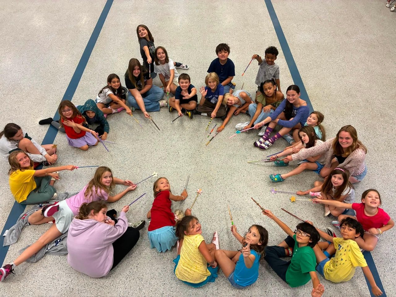 a group of people sitting on the ground