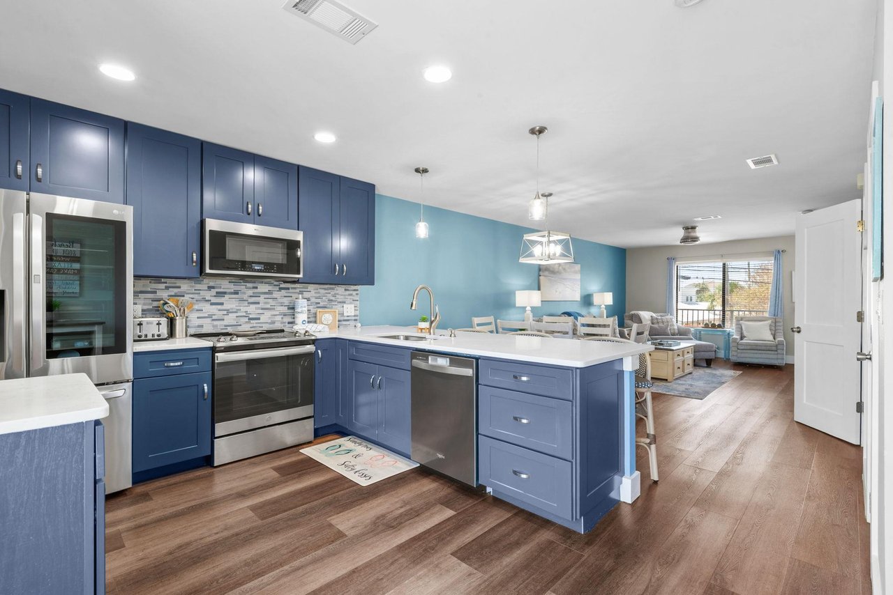An openconcept kitchen is welcoming  perfect for preparing meals together before relaxing in the adjoining living space.