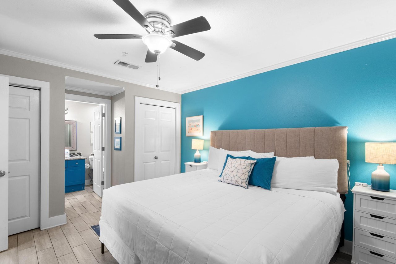 Drift off under a cooling ceiling fan, surrounded by calming oceaninspired blues that welcome you home after a day full of local activities.