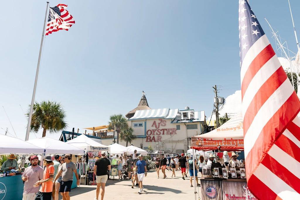 a group of people walking around a fair