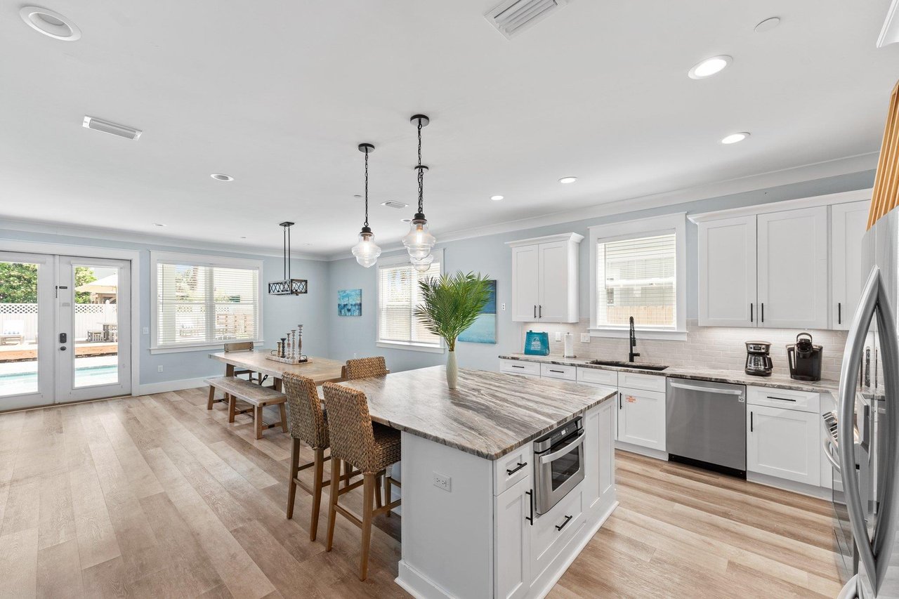 a kitchen with white cabinets