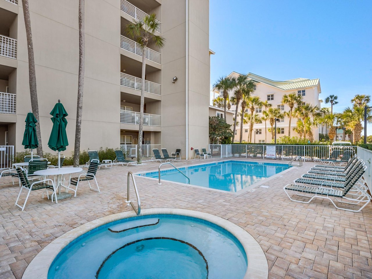 Pool deck with a refreshing swimming pool and hot tub