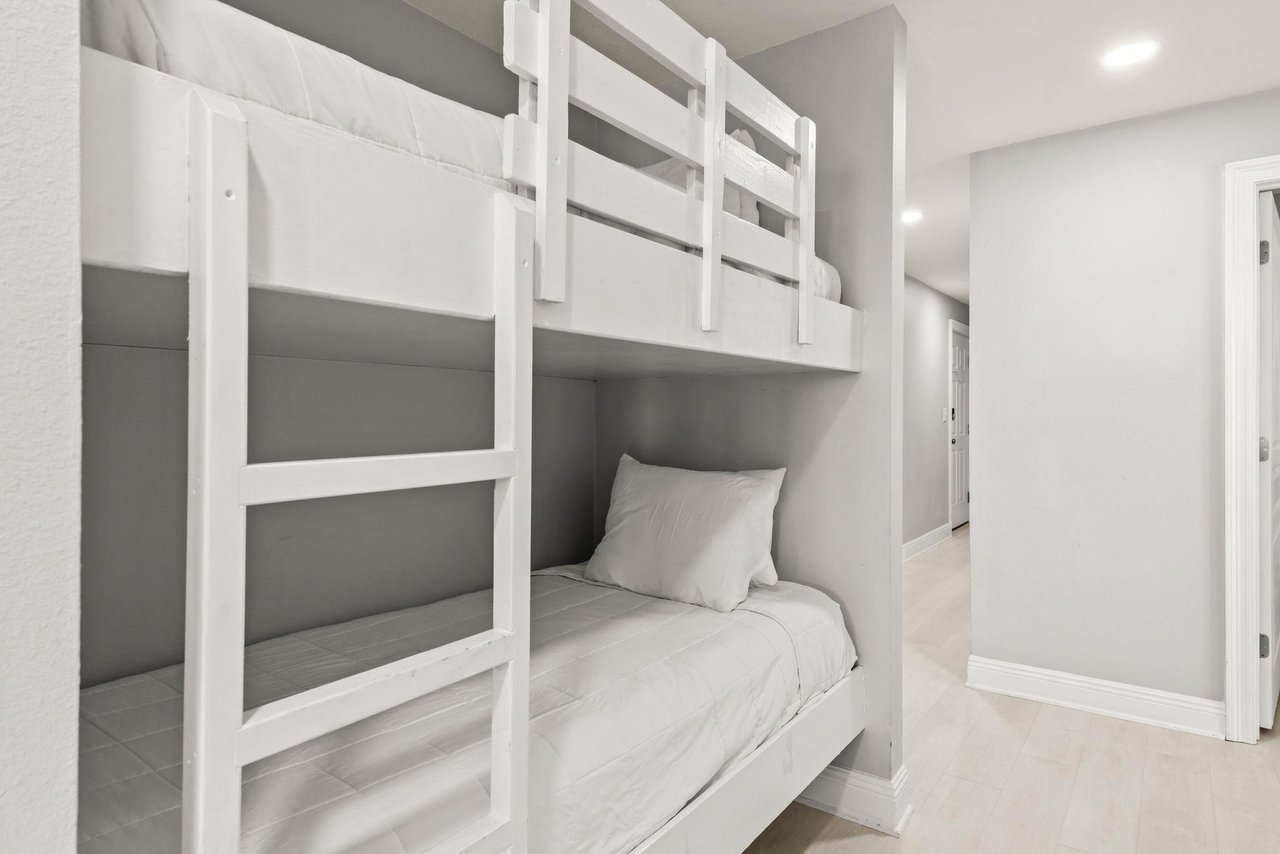 Cozy builtin bunk beds offer a stylish sleep space perfect for families or groups.