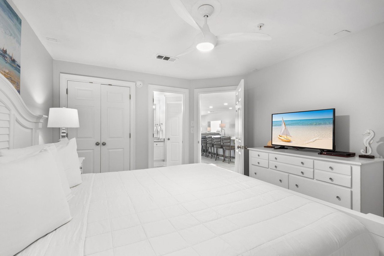 Sink into crisp white linens and let the airy, calming tones wash over you as you unwind in your private bedroom retreat. Catch a favorite show before drifting off to sleep.