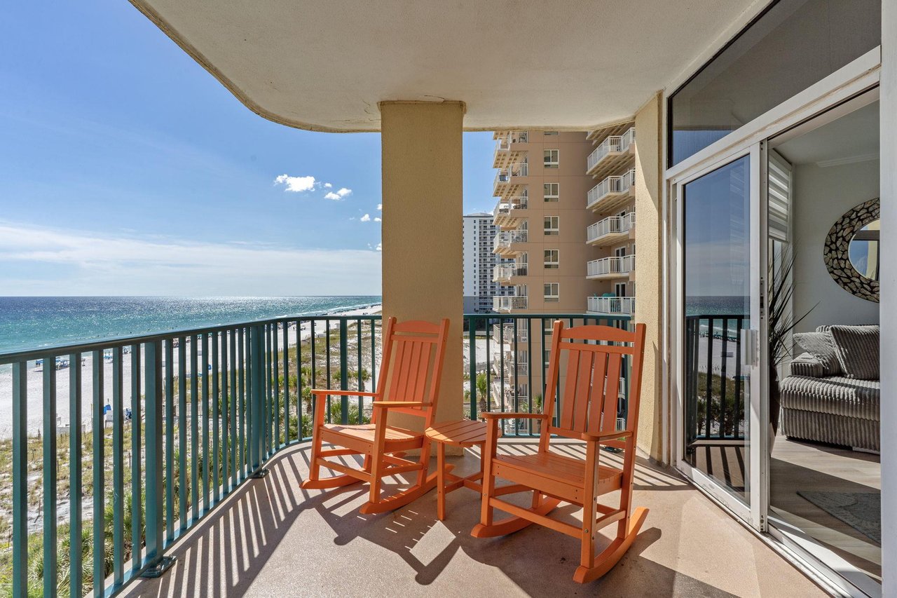 Step onto your private balcony and let the rhythm of the waves set your pace. Two rocking chairs invite you to sit back and savor stunning ocean views just beyond the railing.