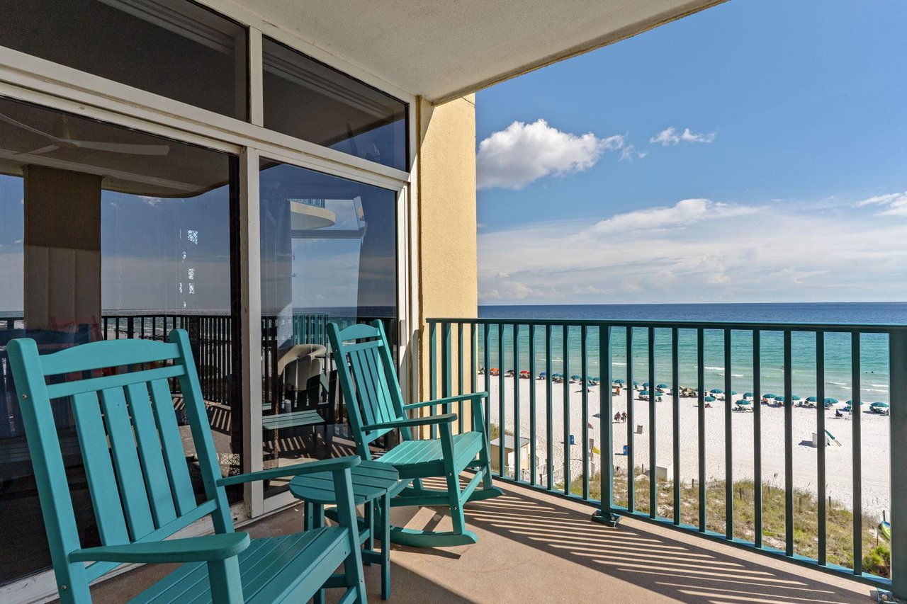 Your private balcony overlooking white sands and turquoise waters, where you can rock gently in the breeze and watch the waves roll in all day long.