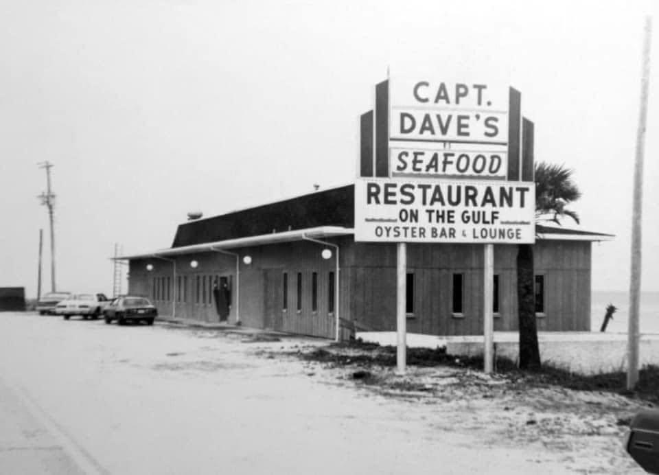 a sign in front of a building