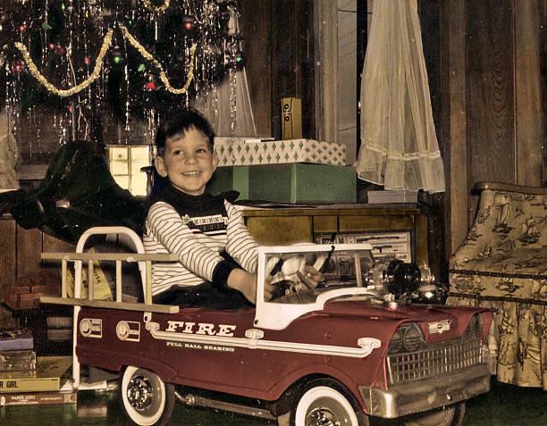 2272750 A Person Sitting In A Small Red Car