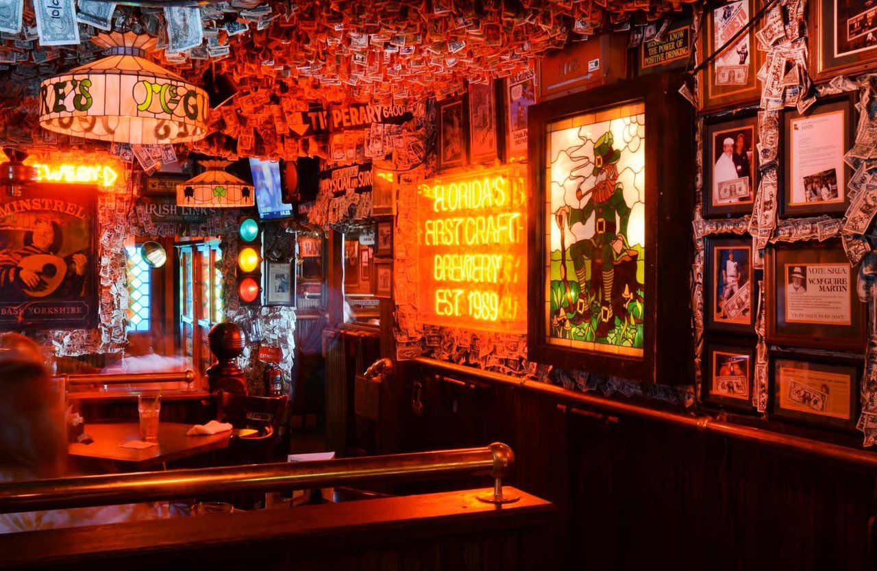 a bar with many signs and posters