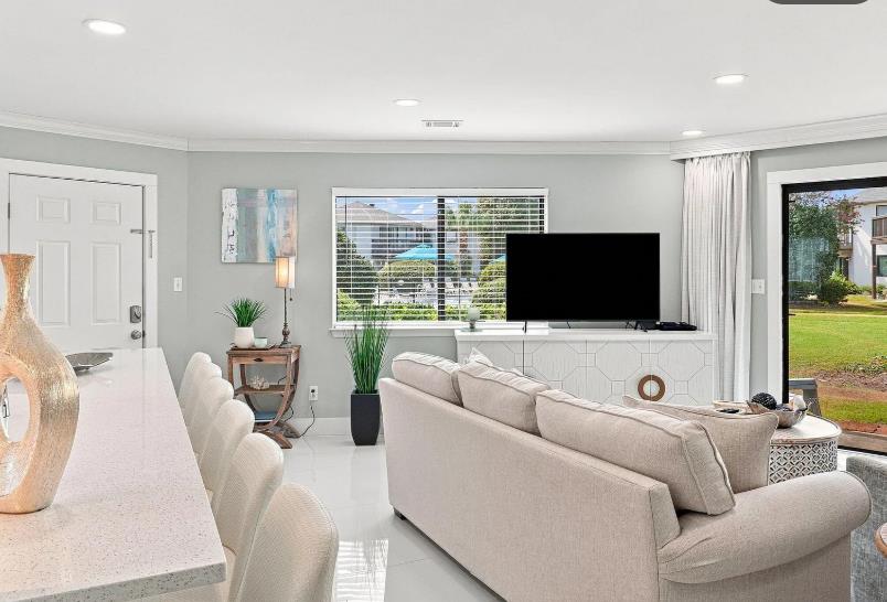 Settle into this bright, beautifully designed living room where plush seating invites you to relax after a day of adventure.