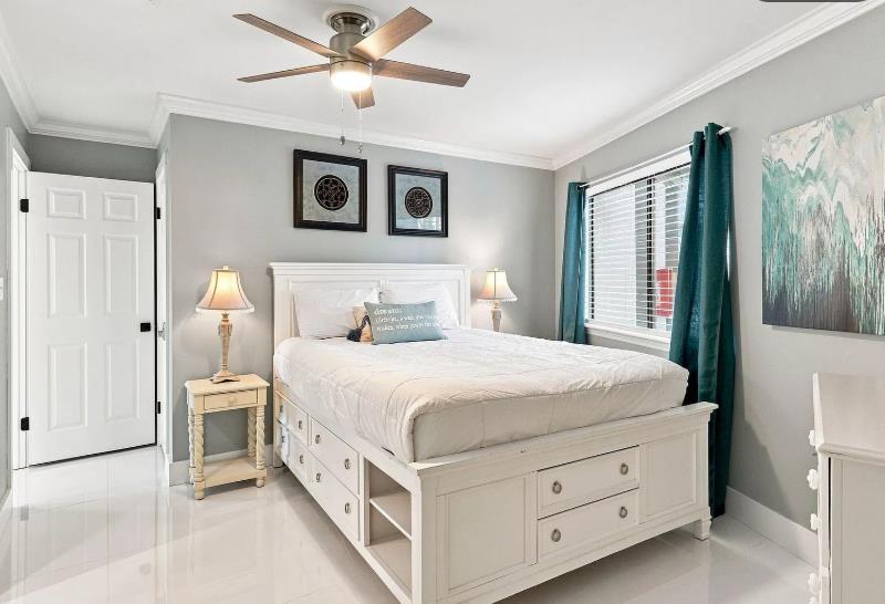 Bedroom 2  Settle into your serene retreat with a welcoming bed and smart storage underneath. Soft lighting and a gentle ceiling fan make your stay comfortable yearround.