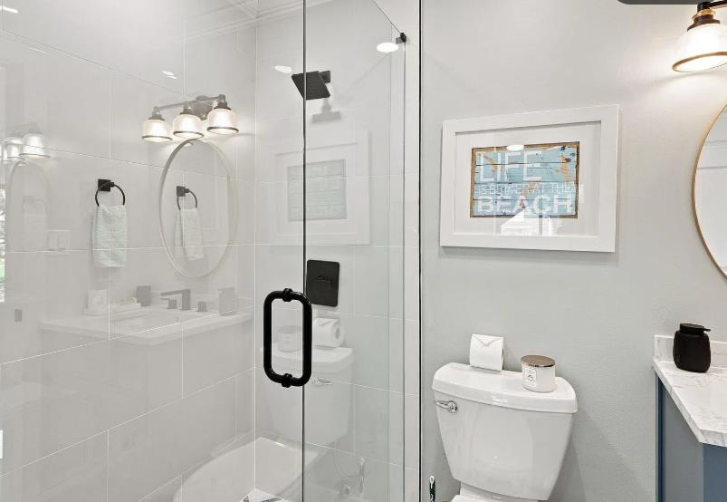 Bathroom 2  Step into your bright, modern bathroom with a spacious glassenclosed shower and elegant fixtures ready for your refreshing morning routine.
