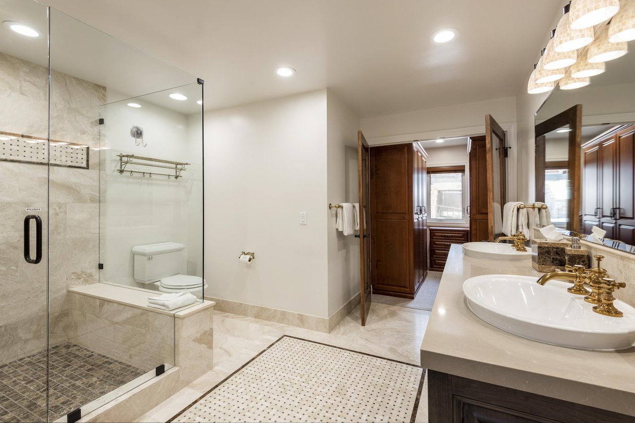 Double vanity bathroom with walk in closet