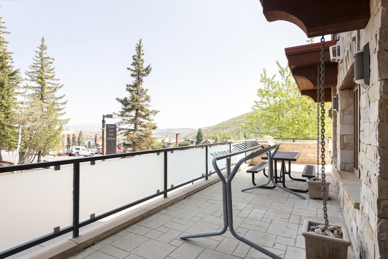 Private ski rack on patio with picnic table in the background