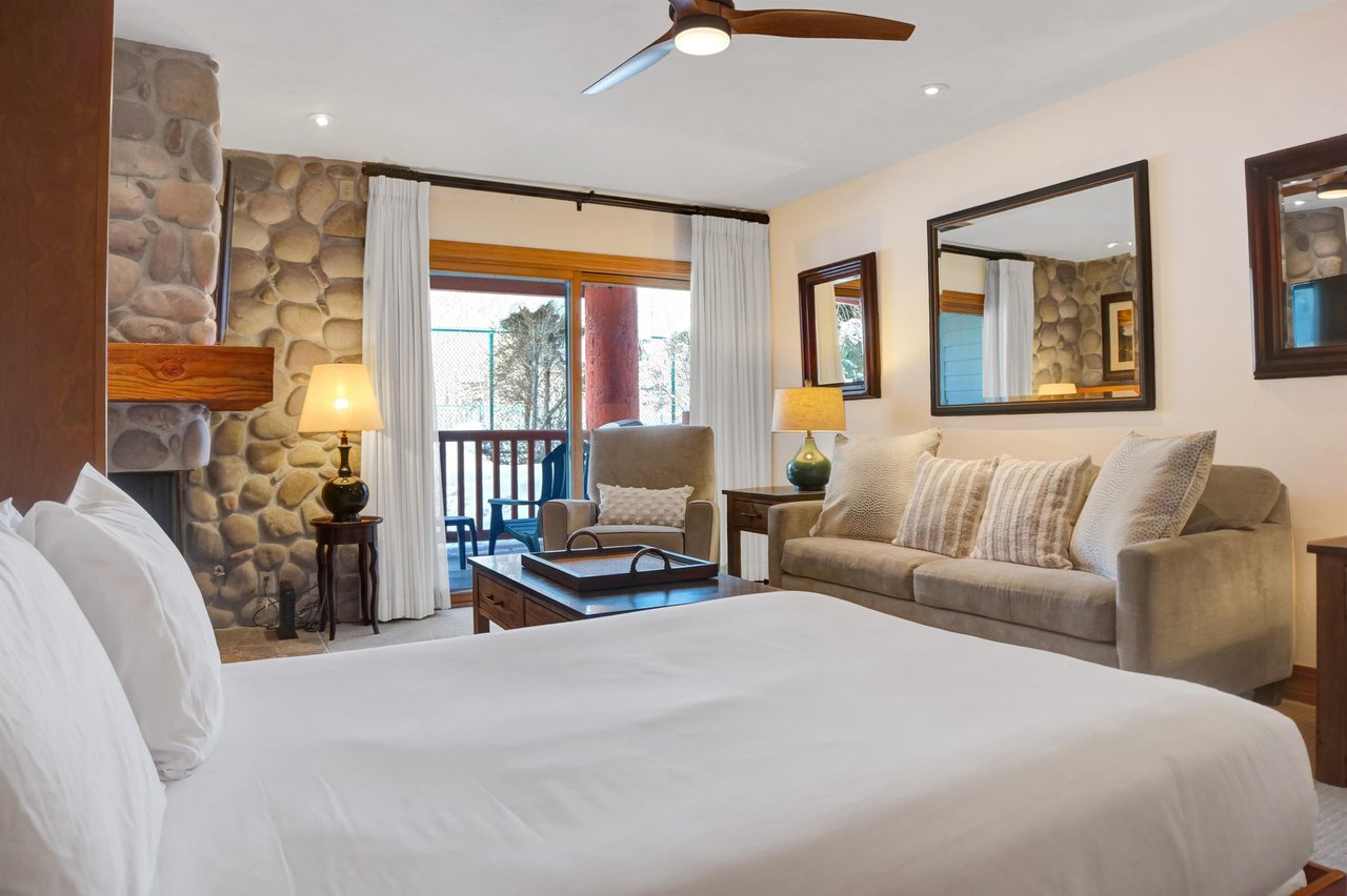 Relax on the queen murphy bed while taking in the views through the sliding glass door