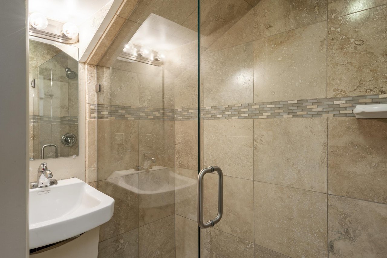 Loft bathroom features a beautiful walkin shower