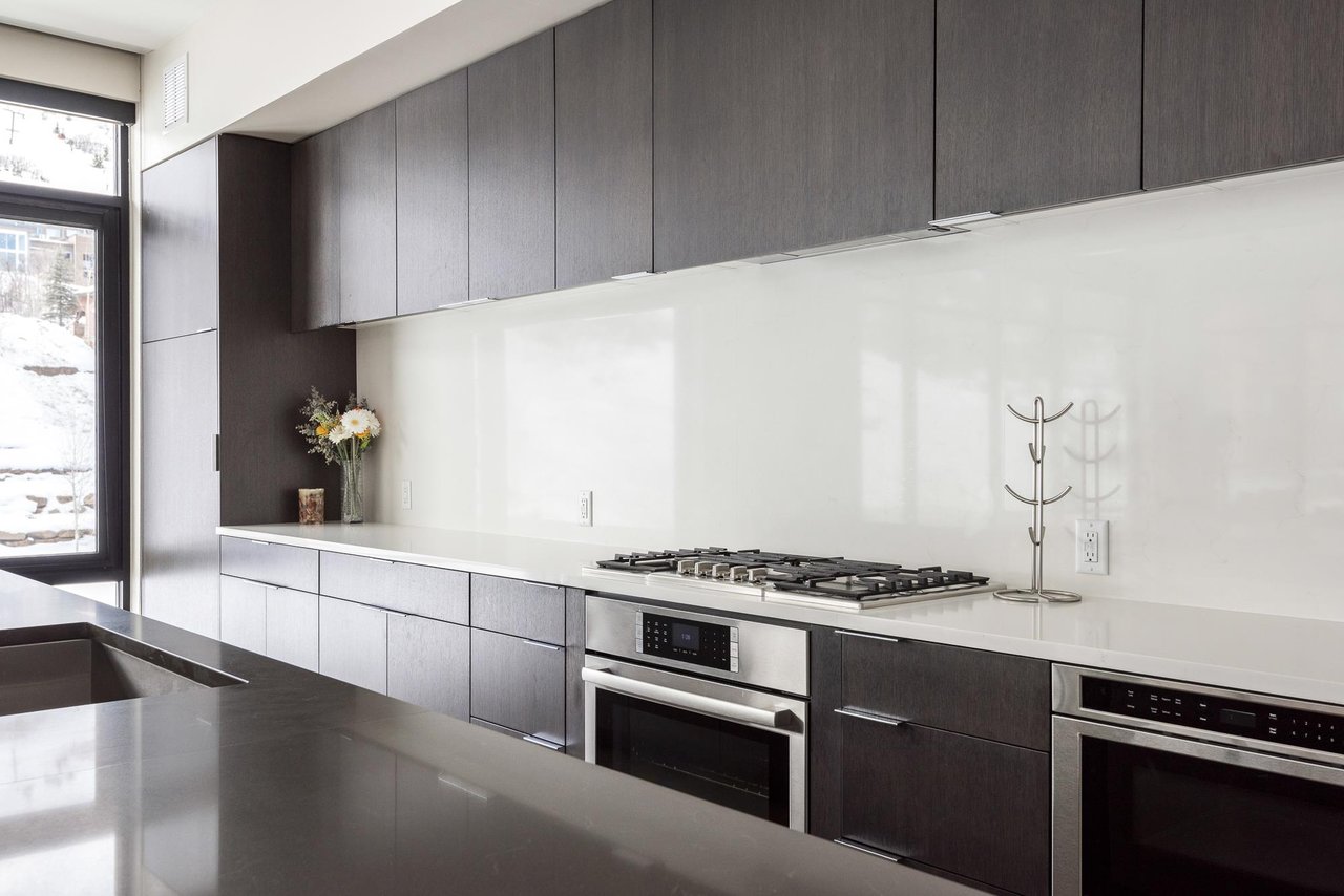Fully equipped chefs kitchen with gas range, microwave drawer, kitchen island
