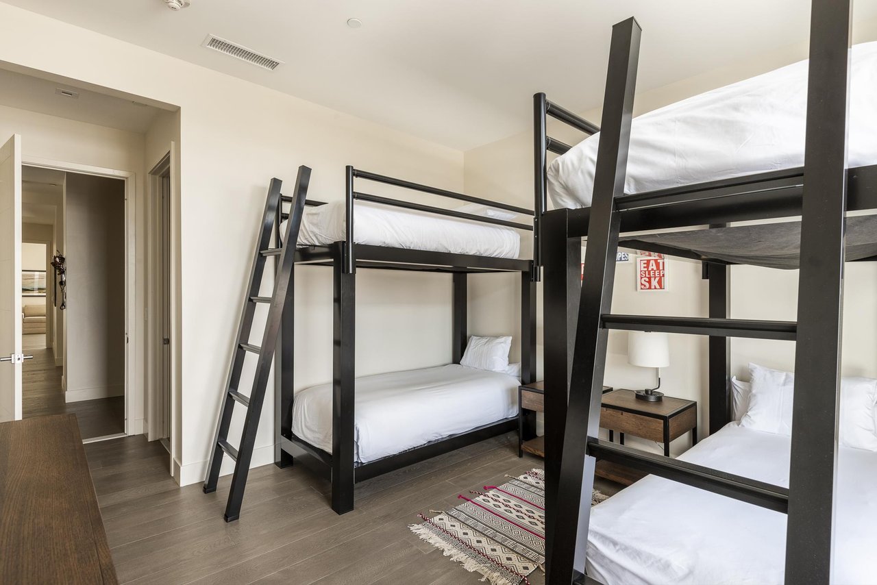 Sleep 4 in this guest bedroom with 2 bunk bed sets, large ladders for easy access to the top bunks