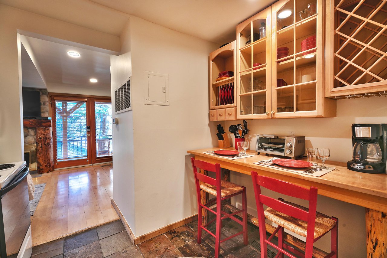 Cozy dining nook with seating for 2 in wooden barstools