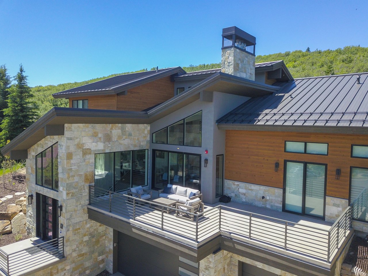 Vacation rental patio that showcases the spacious size and is wrapped with modern railing.