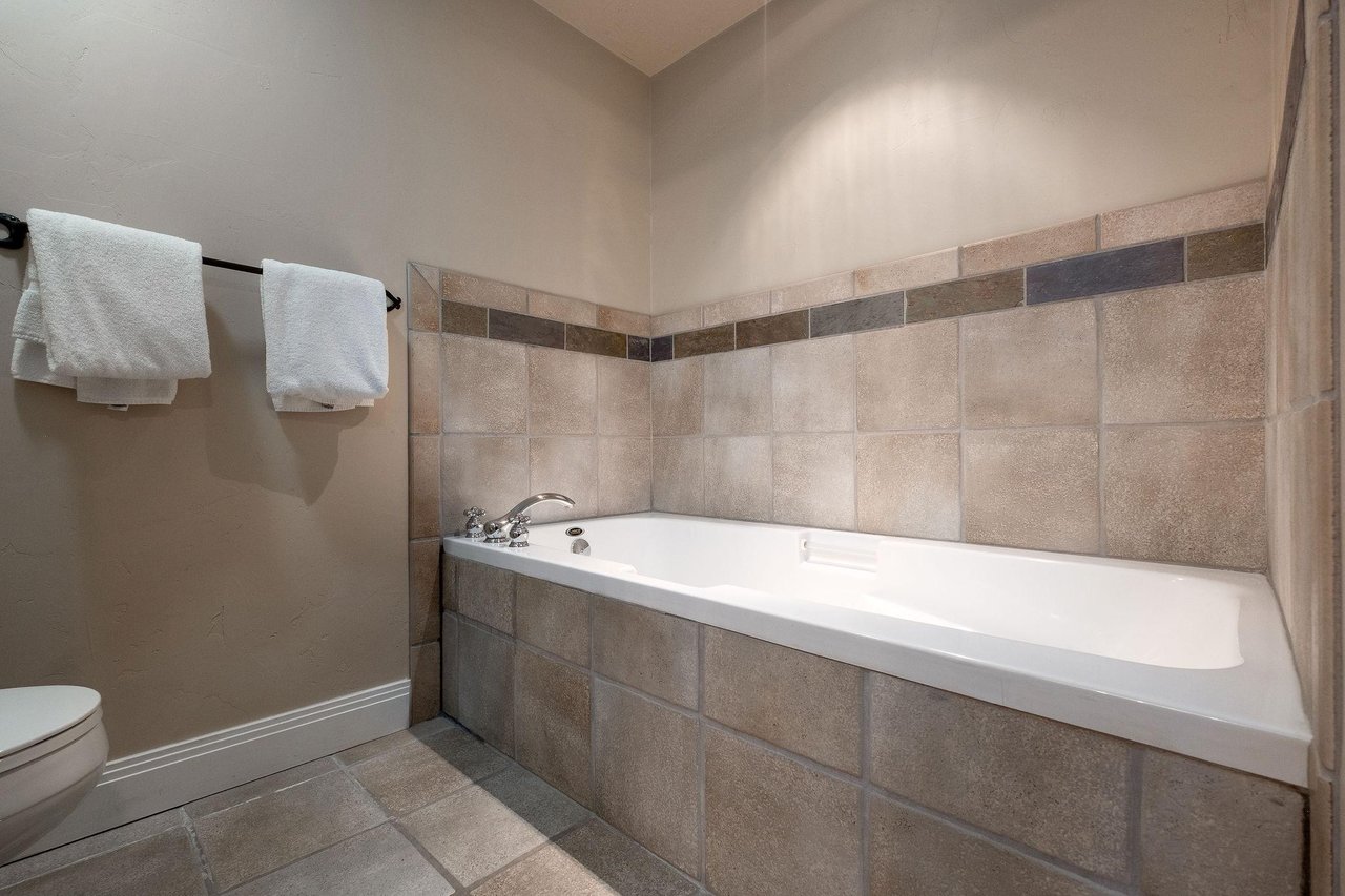 Soaking tub in the main bathroom