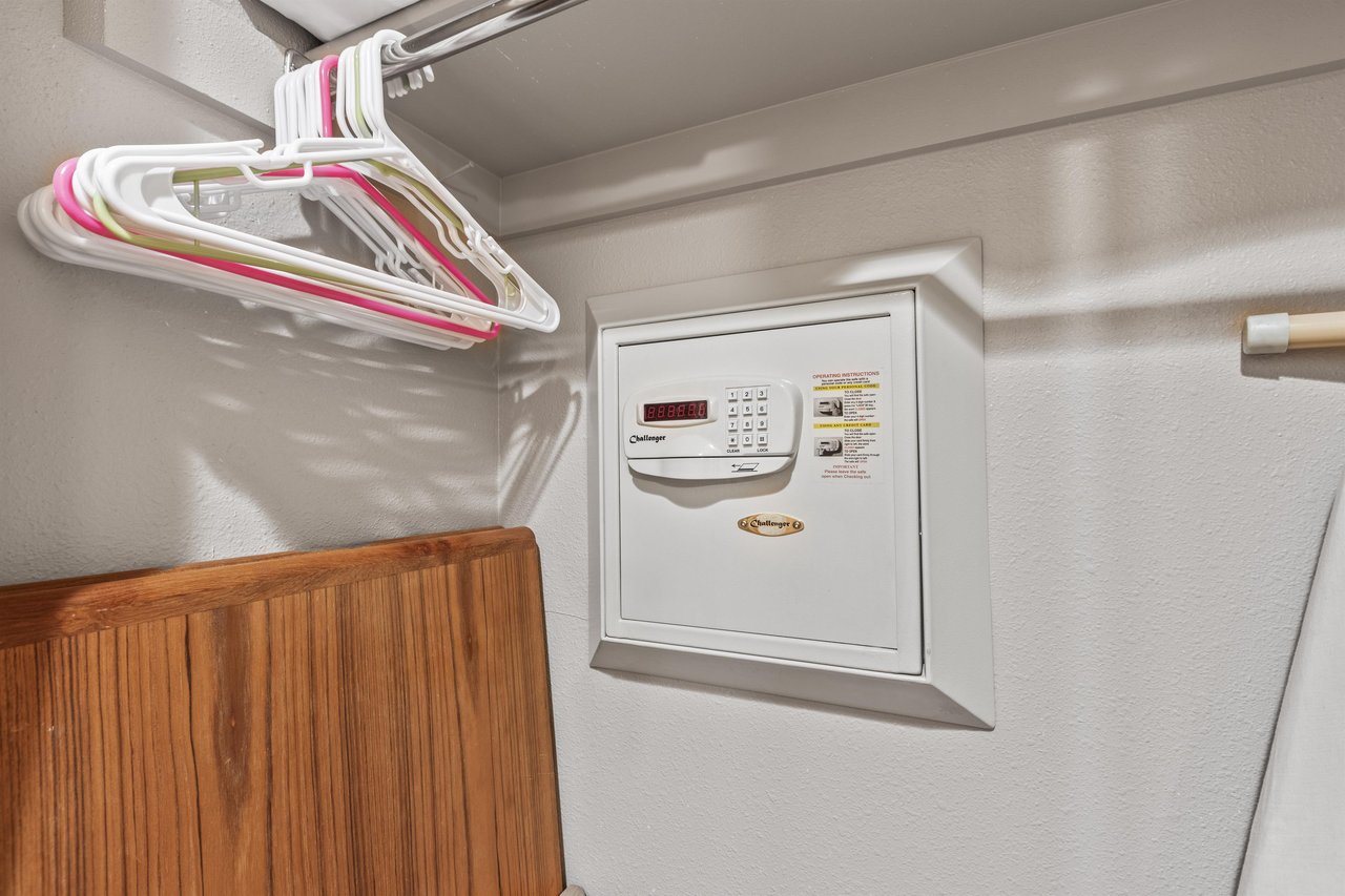 Snow Flower 72s built in wall safe in a closet with hangers.