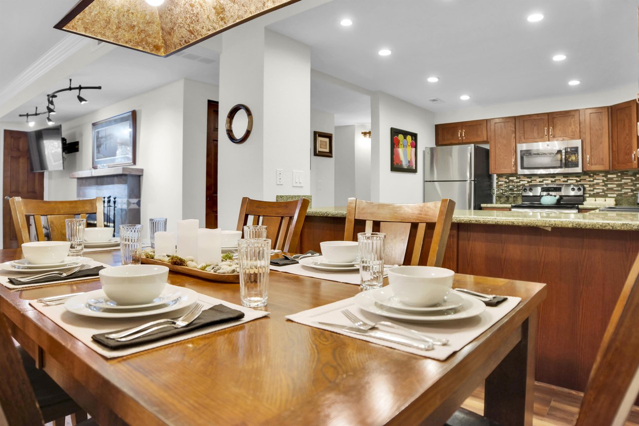 Park Station 113 has a wood dining table, six wood chairs and place settings for 6.