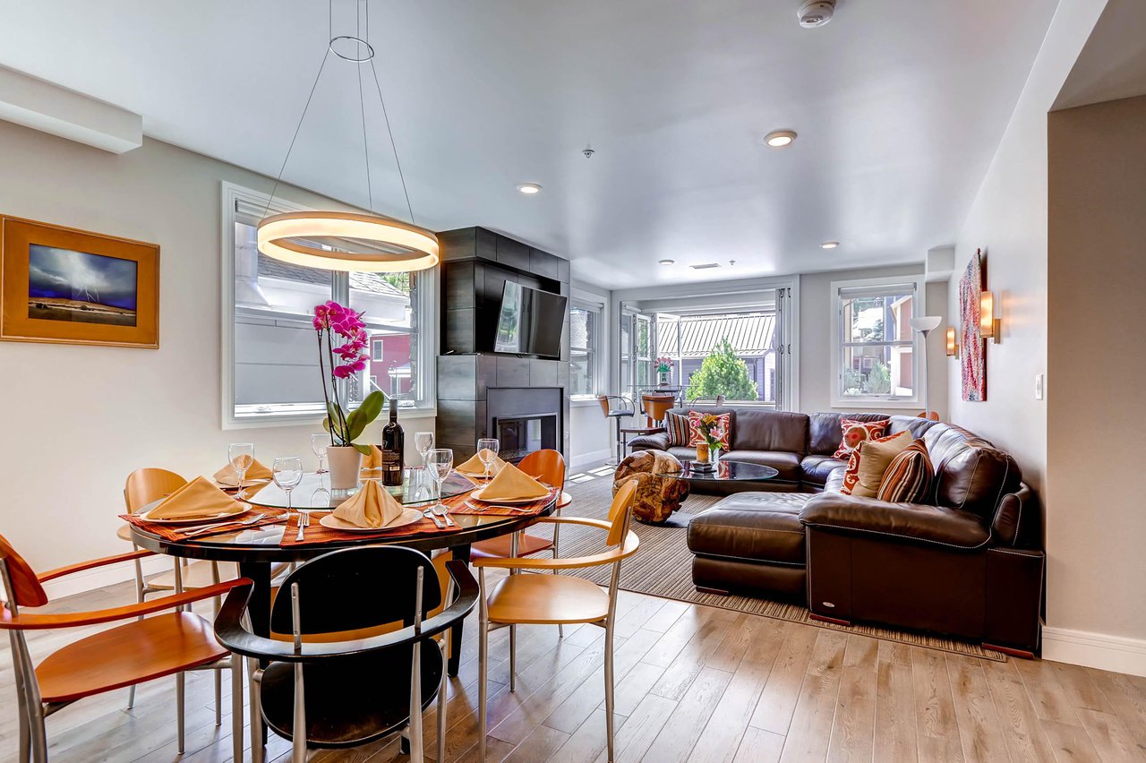 Graceful open floor plan dining table seating 6  ParkCityLodging_820ParkAve204_Dining_2