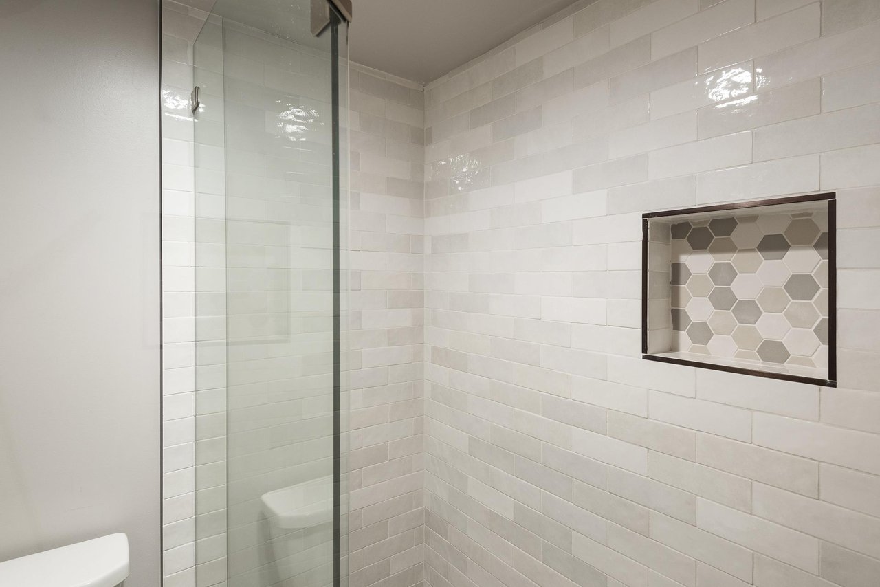 Tiled shower in main bathroom