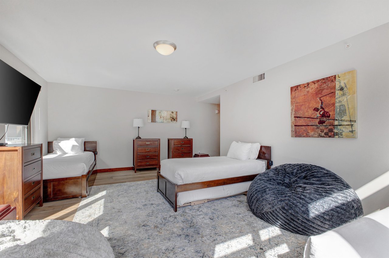 Lowell 402 with three twin beds and bean bag seat.