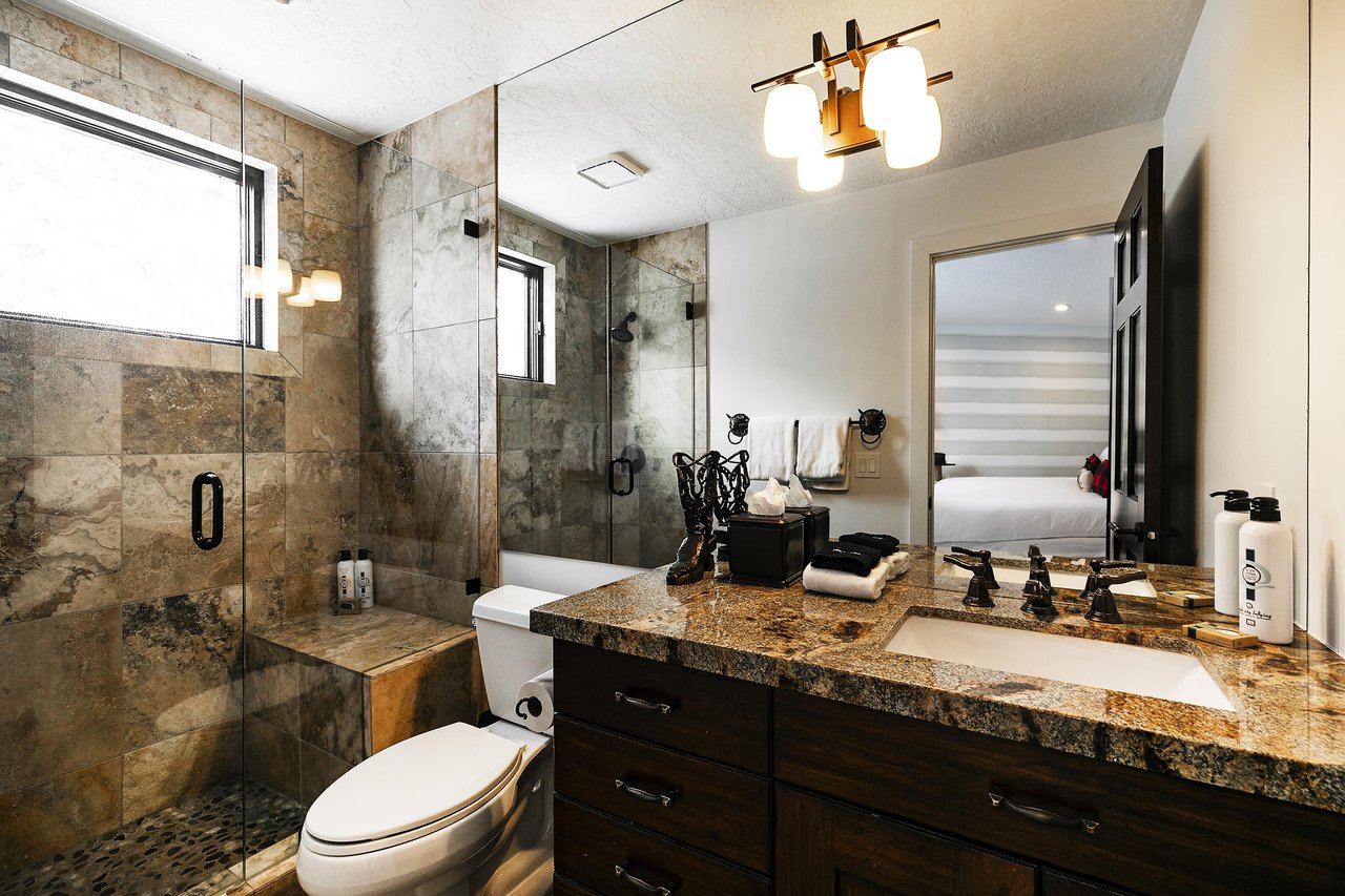 A bathroom with a walkin shower.