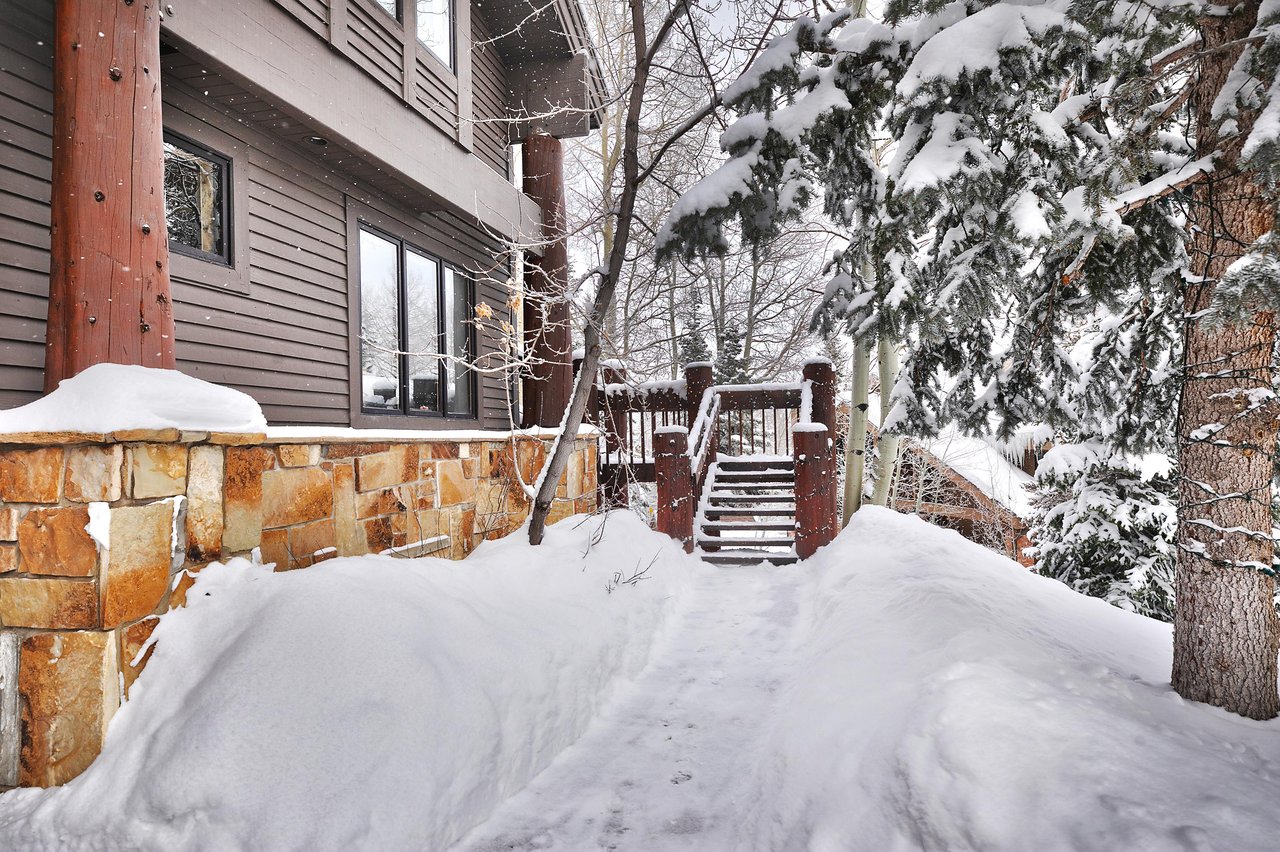 The exterior of Aspen Hollow 6 covered with snow.