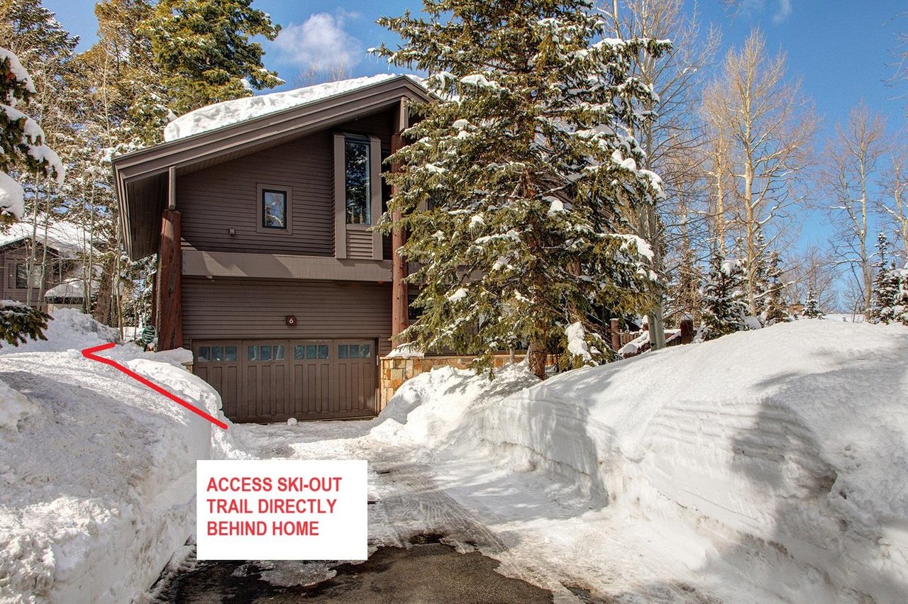 The exterior of Aspen Hollow 6 with a skiout trail to Deer Valley Resort.