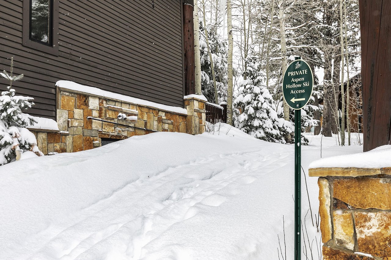 The exterior of Aspen Hollow 6 with a skiout trail to Deer Valley Resort.