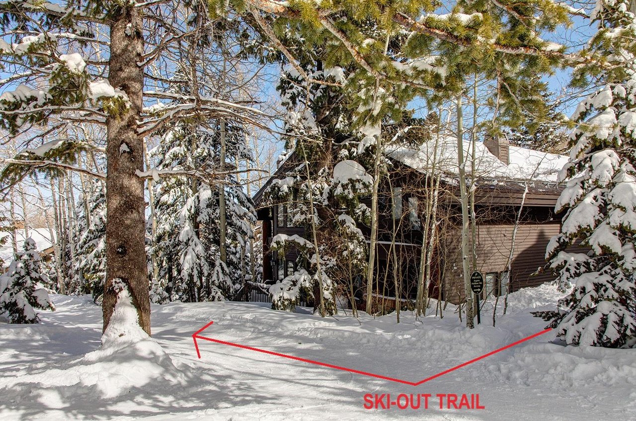 The exterior of Aspen Hollow 6 with a skiout trail to Deer Valley Resort.