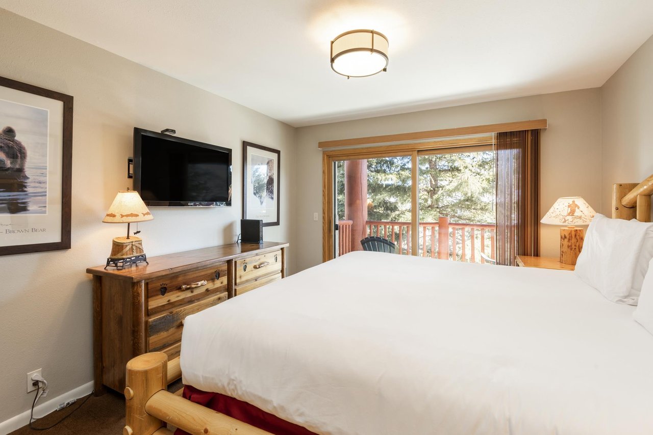 Luxurious kingsized bed with access to the private patio