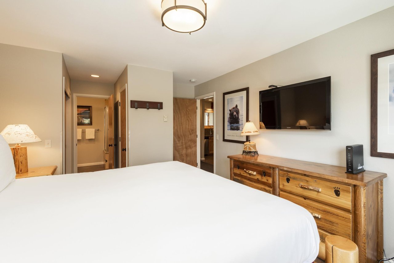 Wall mounted TV in the main bedroom