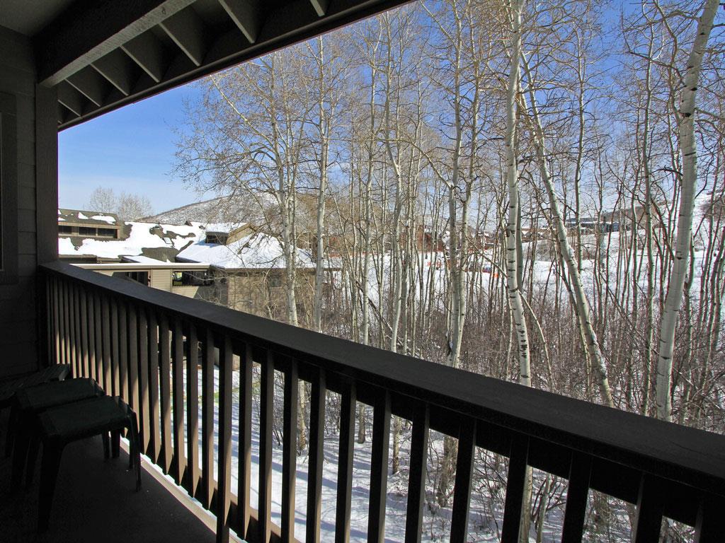 Relax on the deck chairs and take in the aspen grove and resort views.