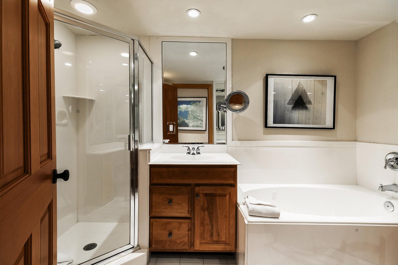 Shared guest bath includes a shower and separate tub