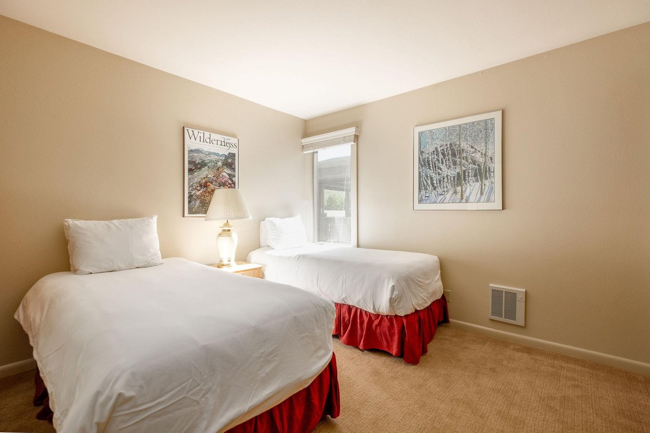 The guest bedroom features two comfortable twinsized beds