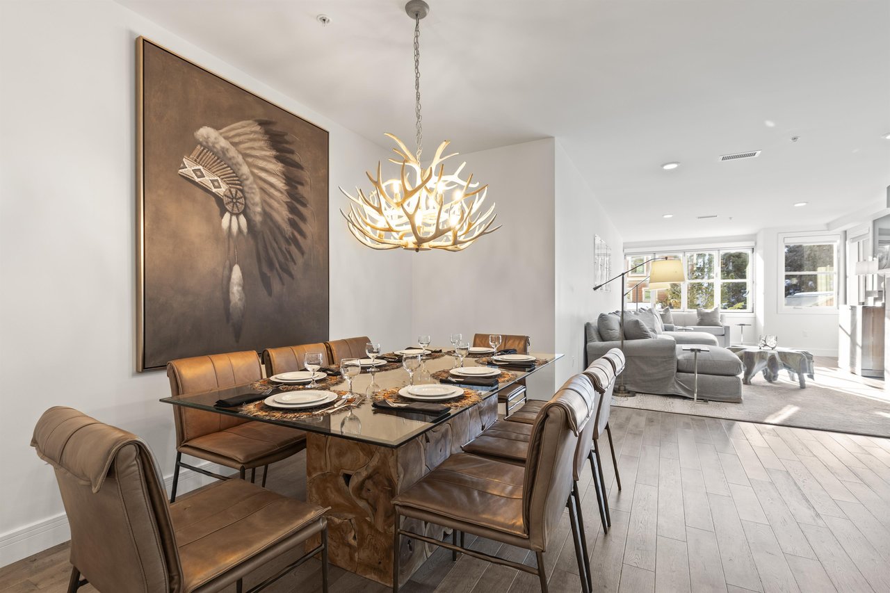 Rio Grande 203 has a stylish dining area with leather chairs and antler chandelier.