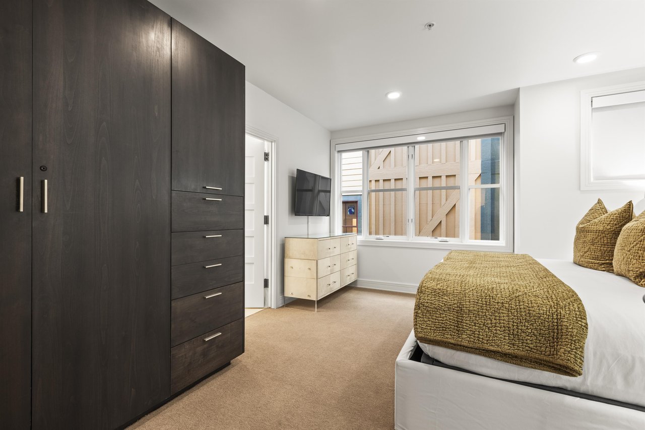 The third bedroom has a king size bed and large wardrobe closet.