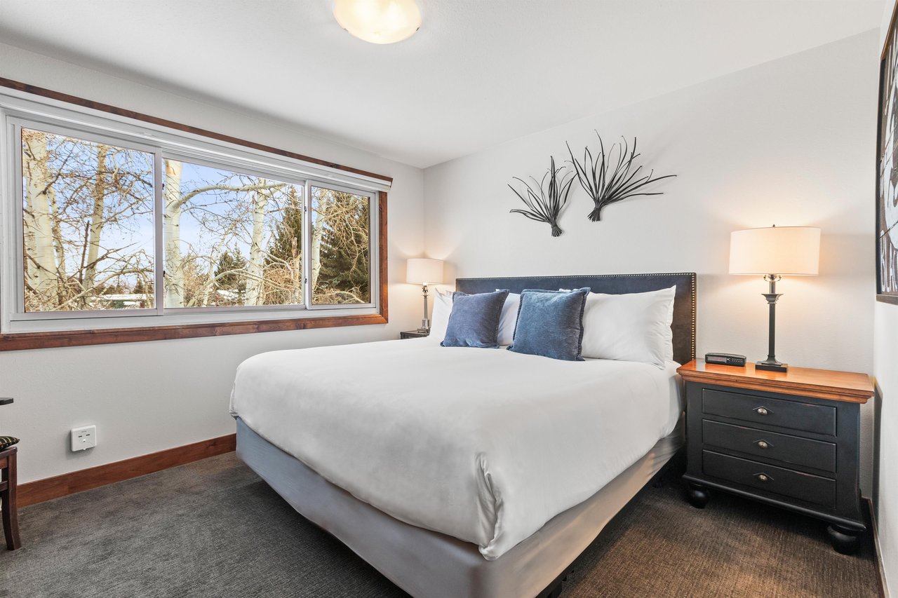 The second bedroom offers a kingsize bed and large picture window.