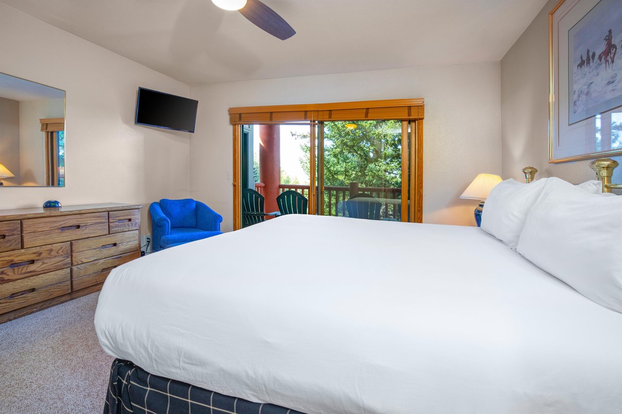 The main suite has a king size bed and private patio access.